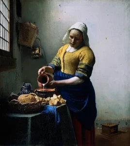 A painting of a milkmaid by a window by the Dutch master Vermeer