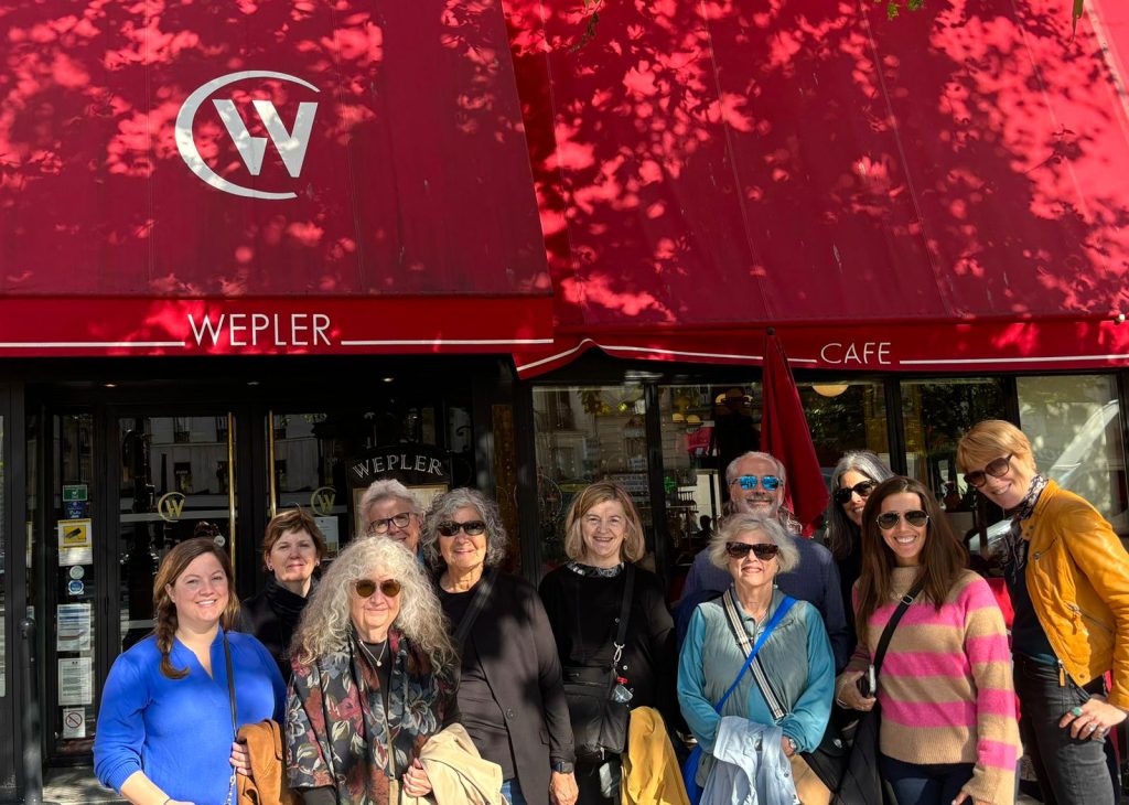 Group standing in front of Wepler cafe